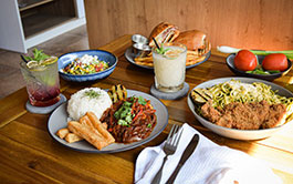 Image of a table of dishes at Flama Llama Kearny Mesa restaurant.