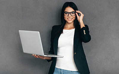 Real Estate Agent holding a laptop