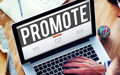 image showing laptop with the word promote