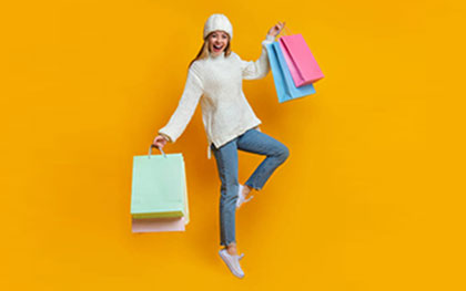 woman holding shopping bags