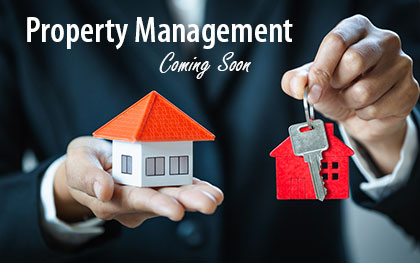 hands holding a model of a house and a key for property management