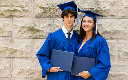 boy and girl in graduation uniform