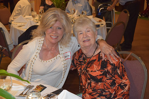 2 women sitting at a table