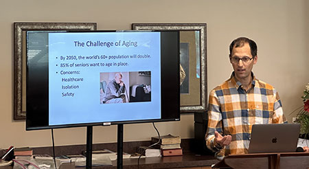 Male giving a presentation on aging