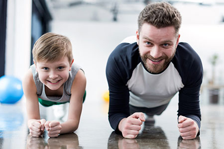 father and son planking